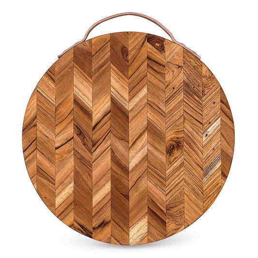 Round wooden cutting board with herringbone pattern and leather handle, perfect for van life kitchens