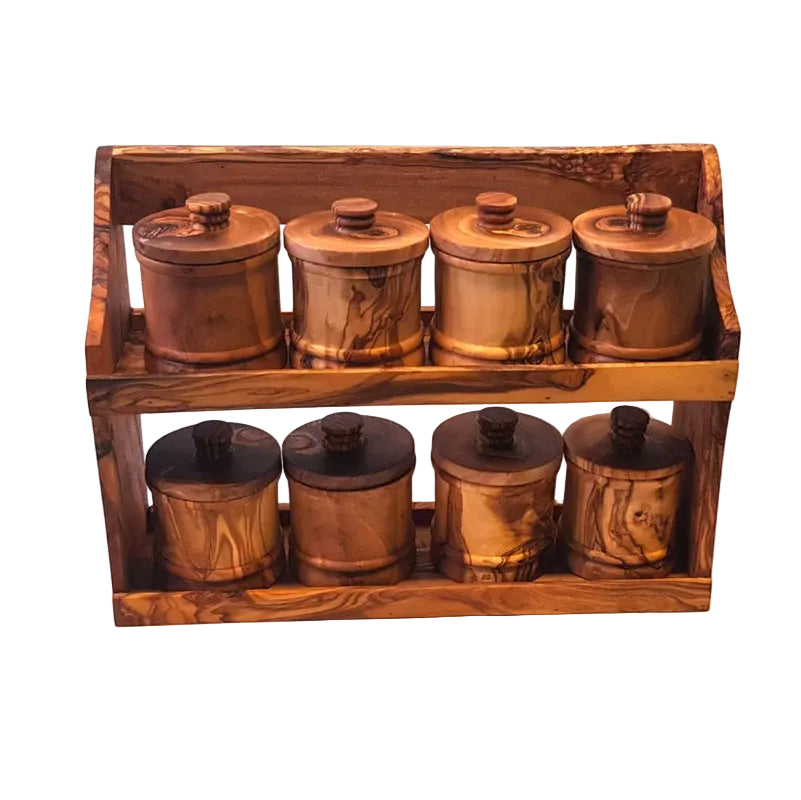 Olive wood spice jars in rustic two-tier holder for van life kitchen organization