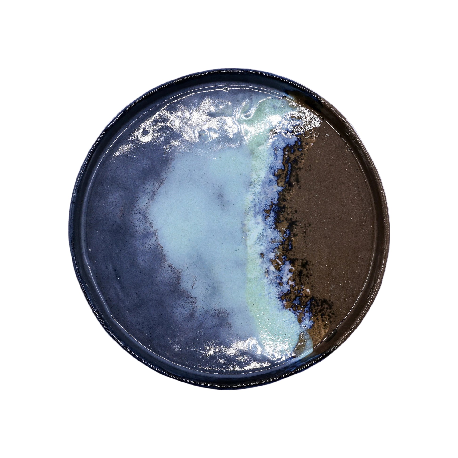 Handcrafted ceramic plate with blue, green, and brown glaze for van life camping kitchen