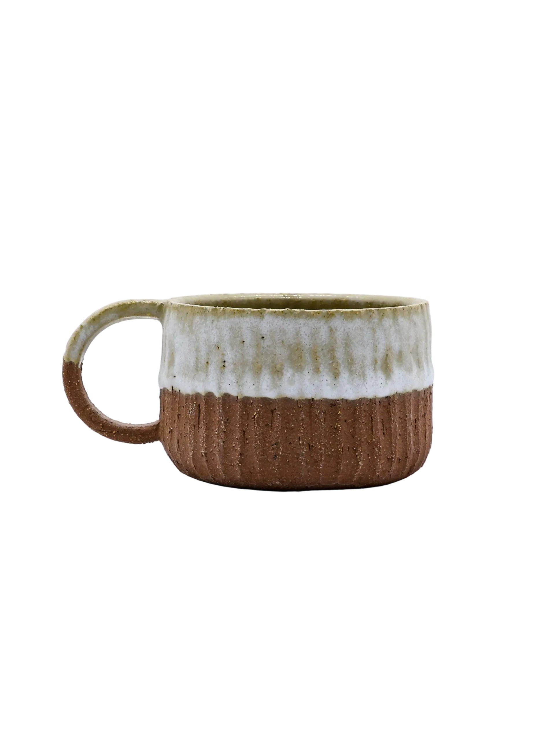 Rustic ceramic mug with ribbed texture, perfect for van life adventures and outdoor camping gear essentials.