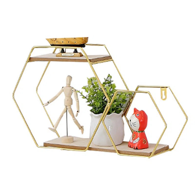 Gold hexagon wall shelf with wooden tiers, holding plant, figurine, and art for van life decor