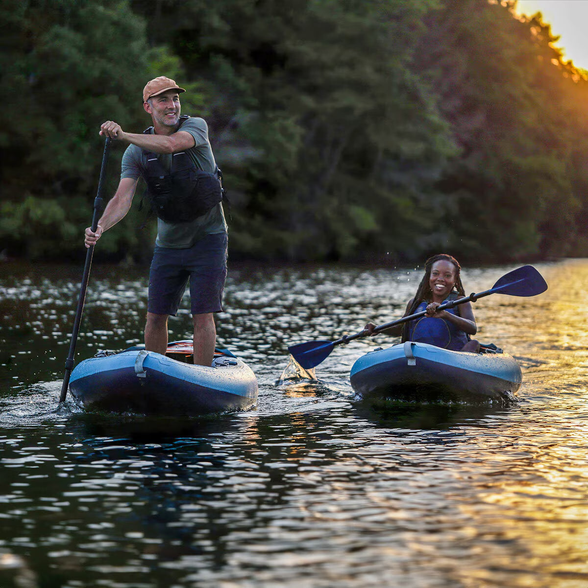 Couple enjoying paddleboarding and kayaking on a lake at sunset, perfect for van life adventures and outdoor gear enthusiasts.