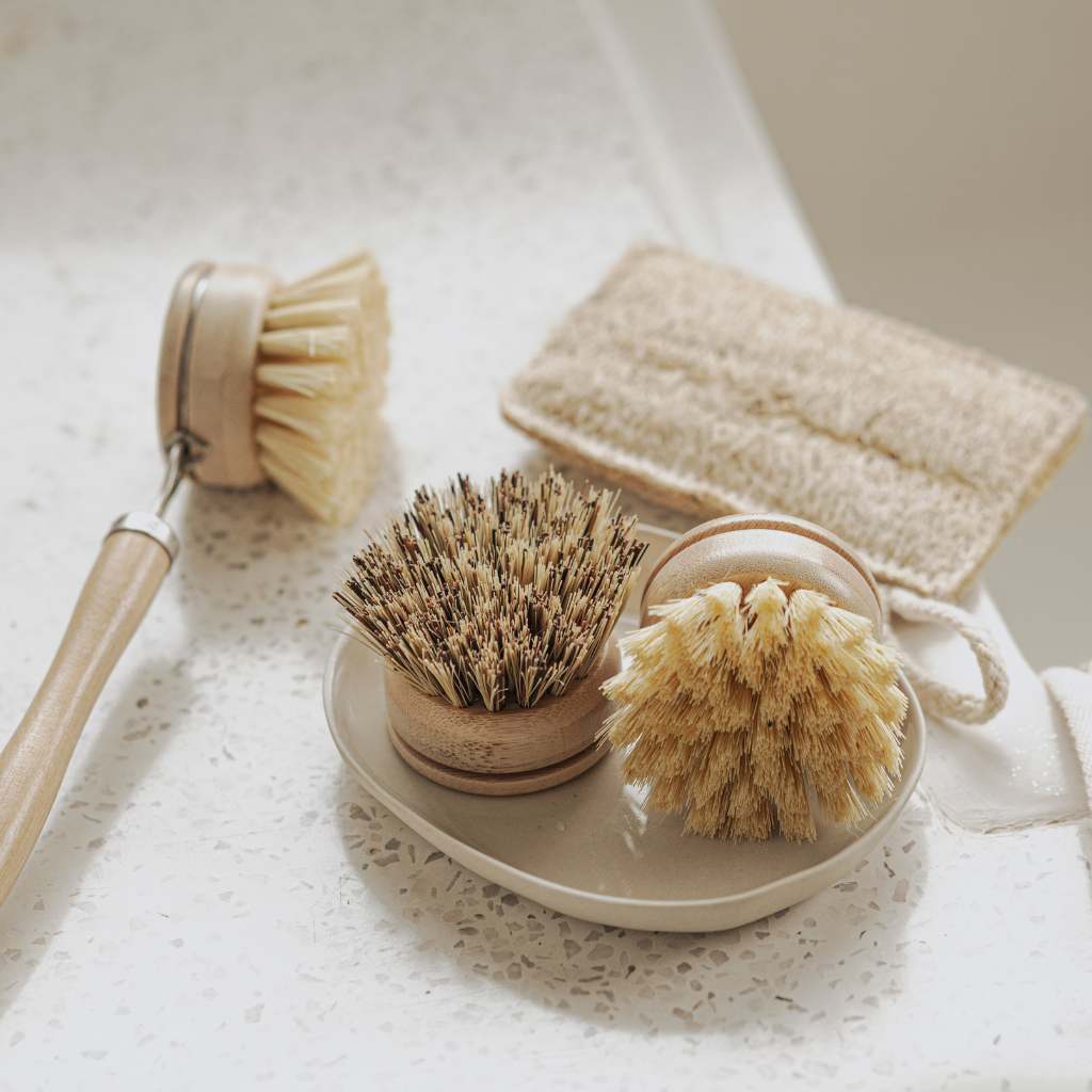 Natural bristle brushes and sponge for van life cleaning essentials