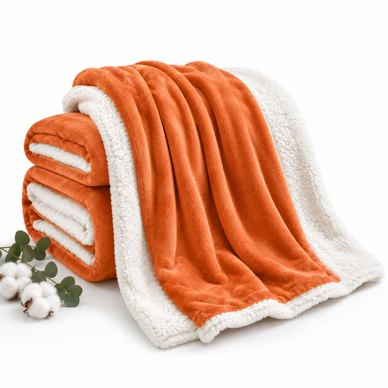 Cozy orange and white reversible blanket, perfect for van life and outdoor adventures.