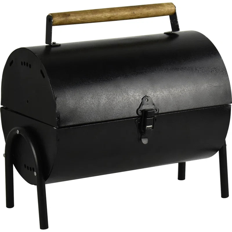 Compact black portable BBQ grill with wooden handle, ideal for van life and outdoor adventures