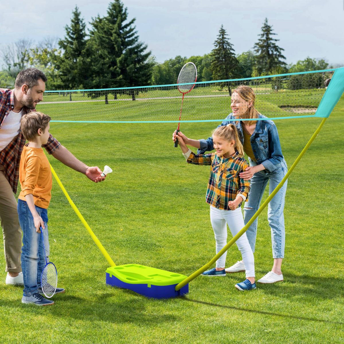 Family playing badminton outdoors with portable net, perfect for van life adventures and outdoor fun