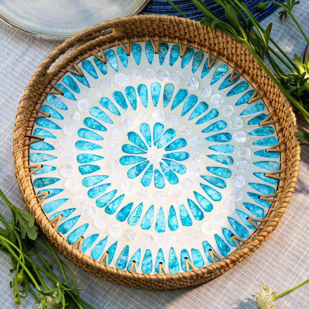 Woven rattan tray with blue and white shell mosaic, perfect for van life decor and outdoor adventures