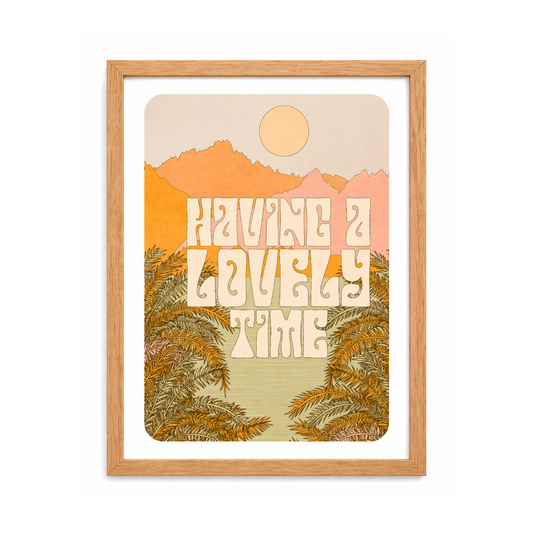 Framed 'Having a Lovely Time' wall art with palm trees, sunset mountains — perfect van life decor