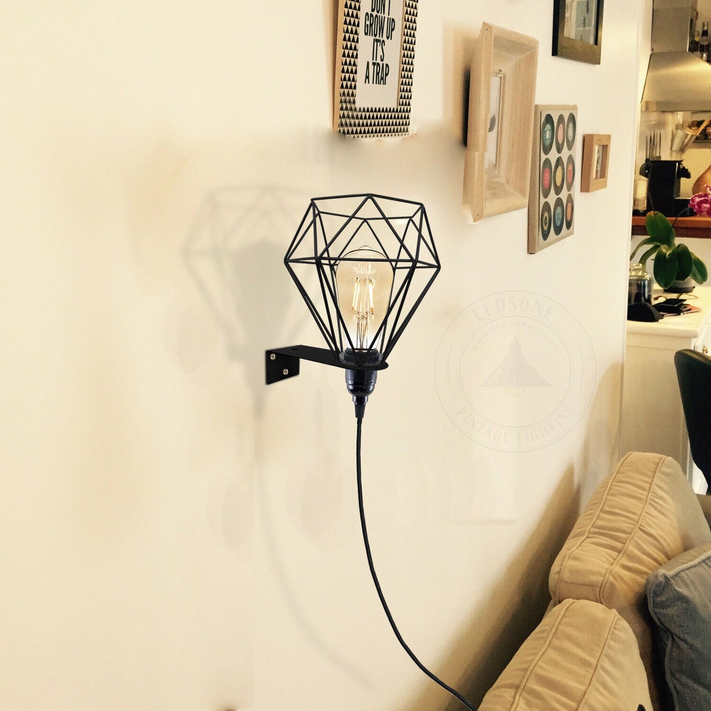 Black geometric wall sconce with Edison bulb, perfect for van life or cozy home decor