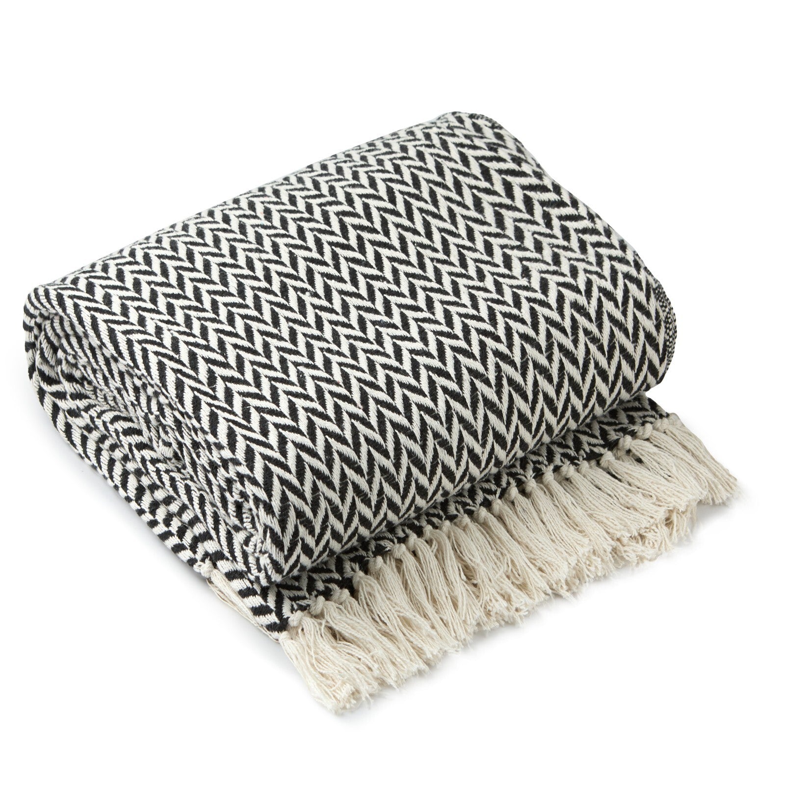Black and white herringbone throw blanket with cream tassels for van life or camping comfort