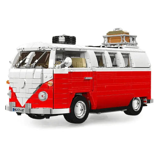 Red and white LEGO camper van with roof rack, spare tire, and luggage for van life adventures