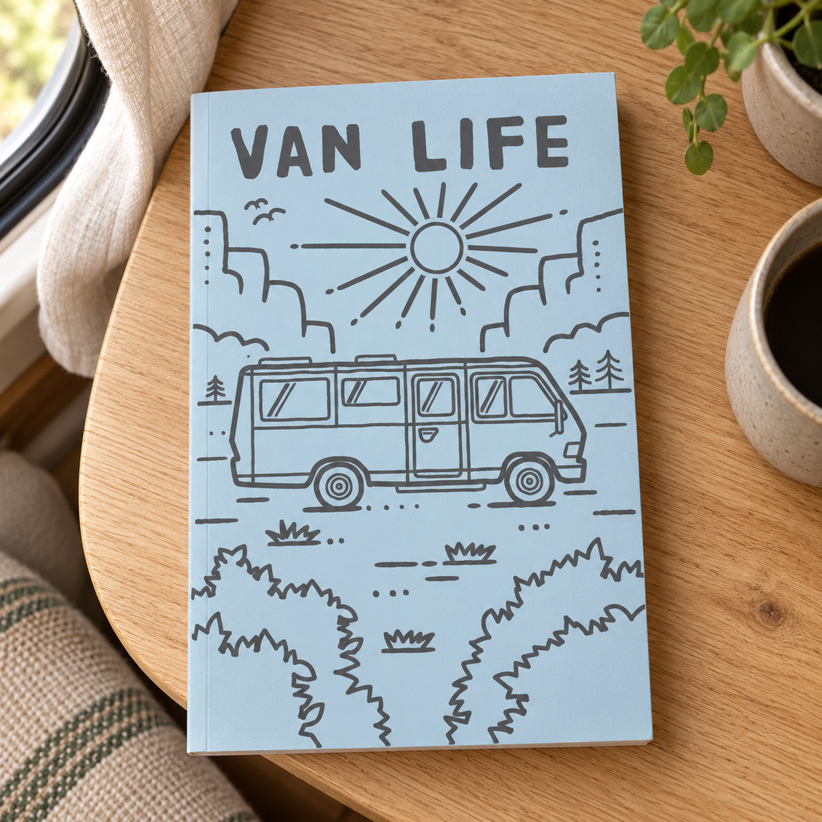 Van Life Journal – Retro Campervan Notebook – book on a wooden campervan table