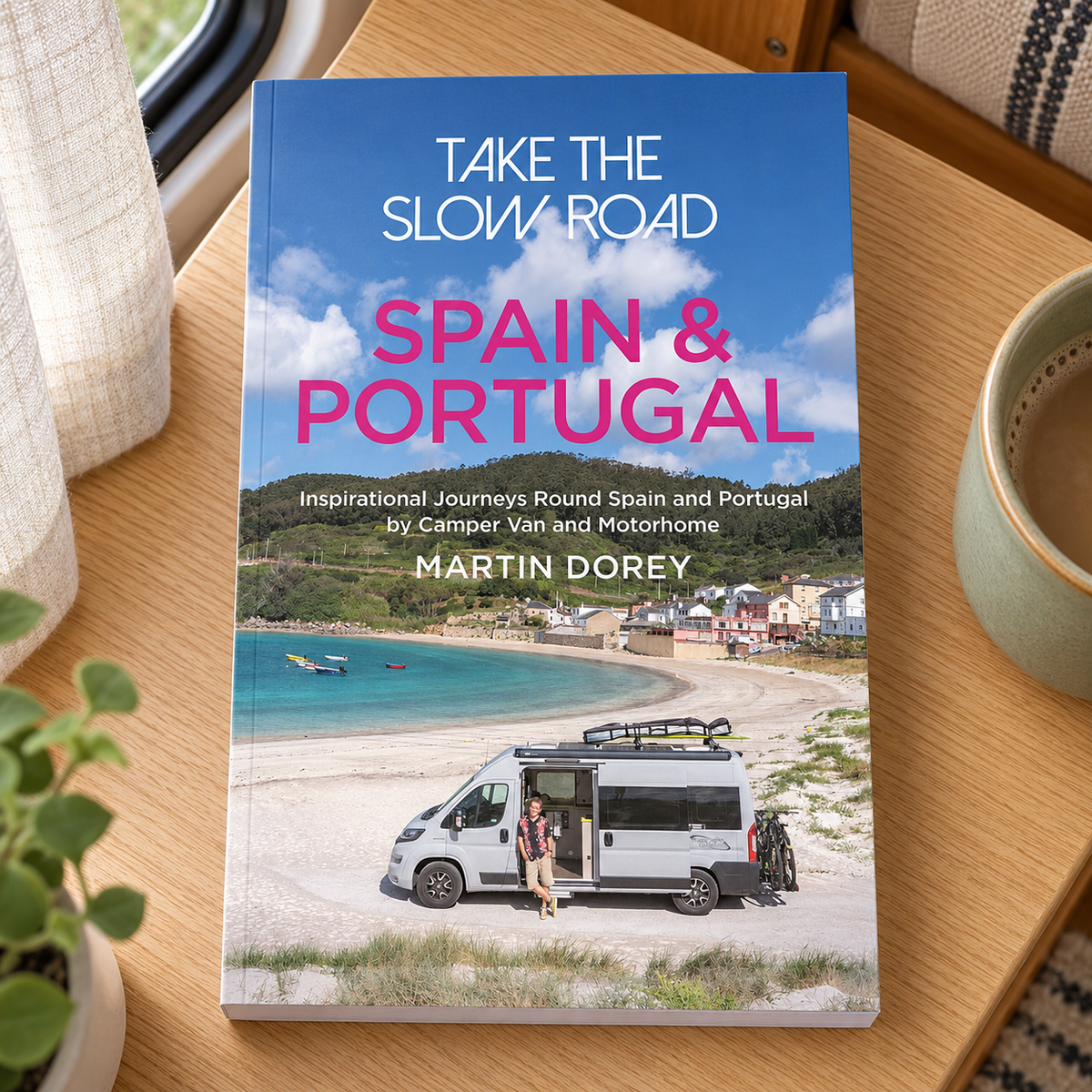 Take the Slow Road: Spain and Portugal – book on a wooden campervan table