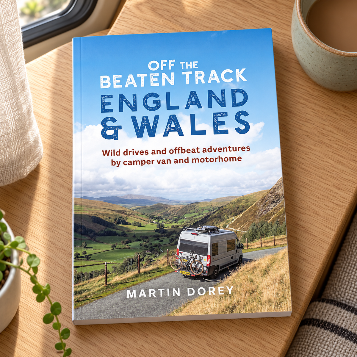 Off the Beaten Track: England and Wales – book on a wooden campervan table
