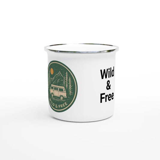 White enamel mug with 'Wild & Free' text and van life mountain graphic, perfect for campers and adventurers.